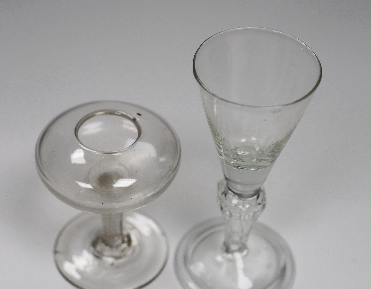 An 18th century glass oil lamp with a Silesian stemmed wine glass, tallest 13.5cm